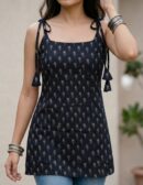 Trendy sleeveless short kurti in black and white floral print, perfect for casual and summer wear.